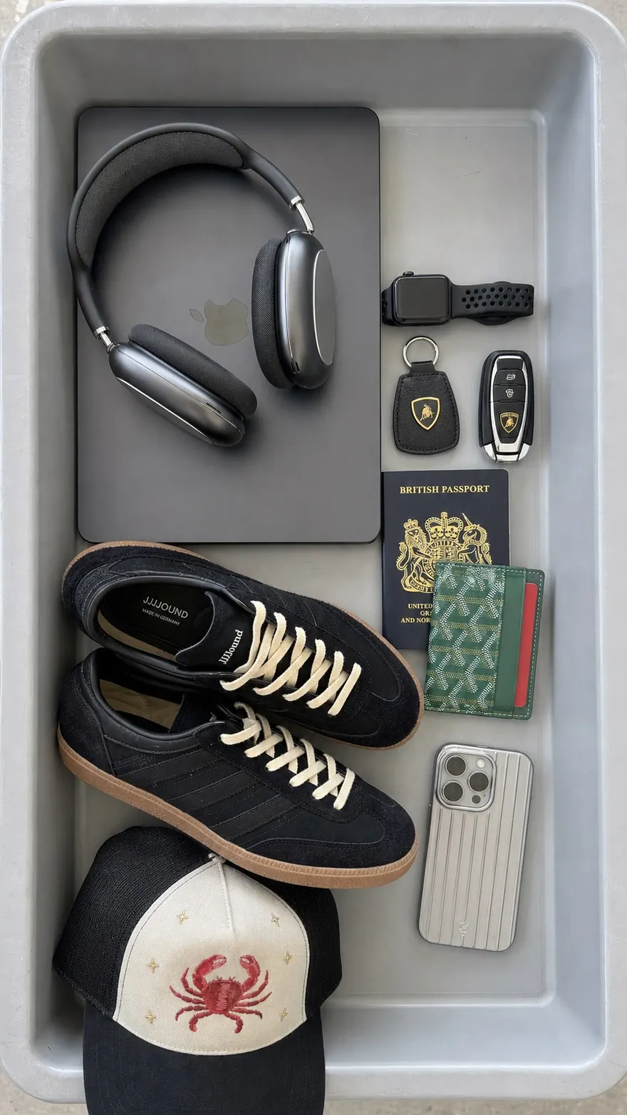 Airport Tray Flat Lay: Overhead flat lay of everyday carry in a security bin