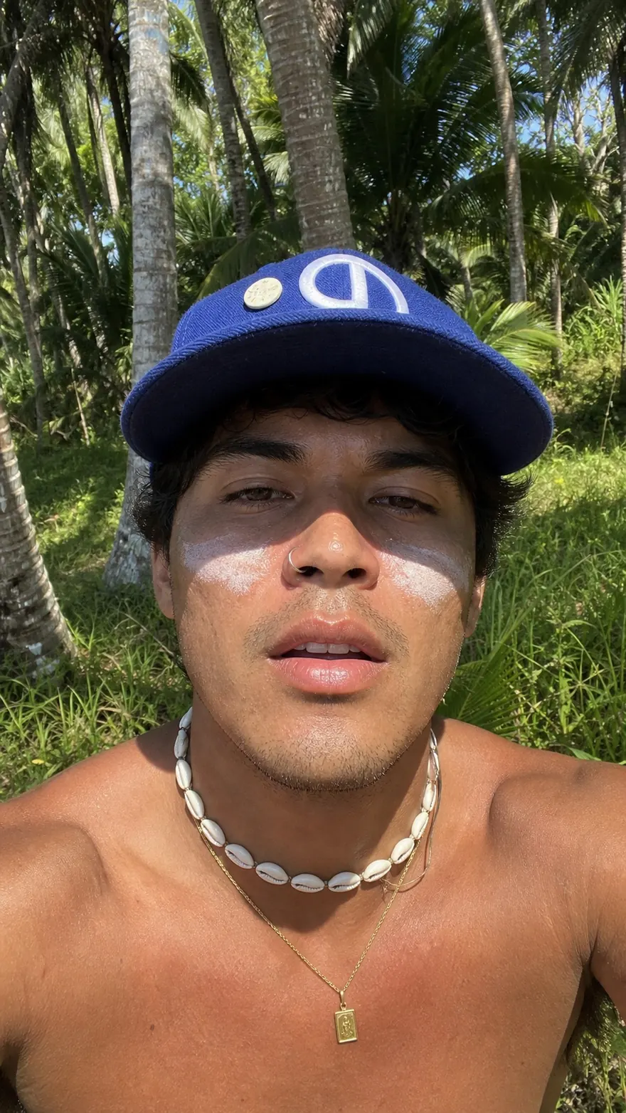 Blue Cap Selfie: Tight front-camera selfie under a royal-blue flat brim