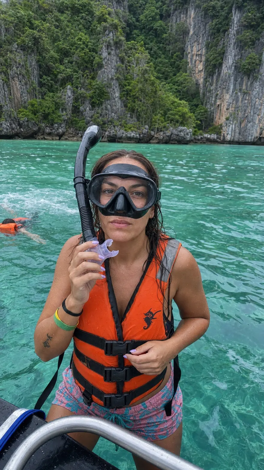 Boat Ladder Snorkeler: Back at the ladder in a full-face snorkel mask