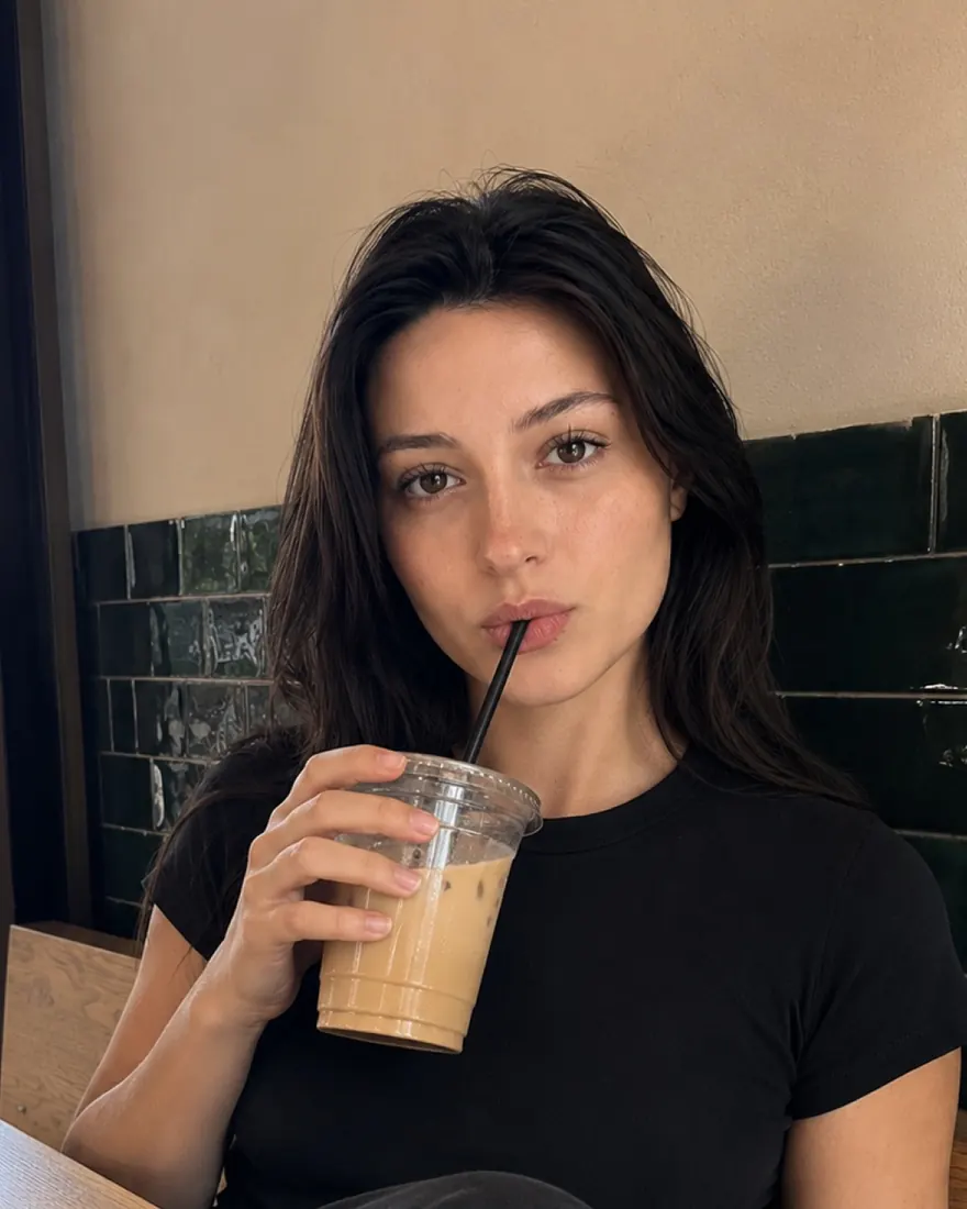 Café Portrait, Iced Coffee: Close-up portrait sipping iced coffee against green tile