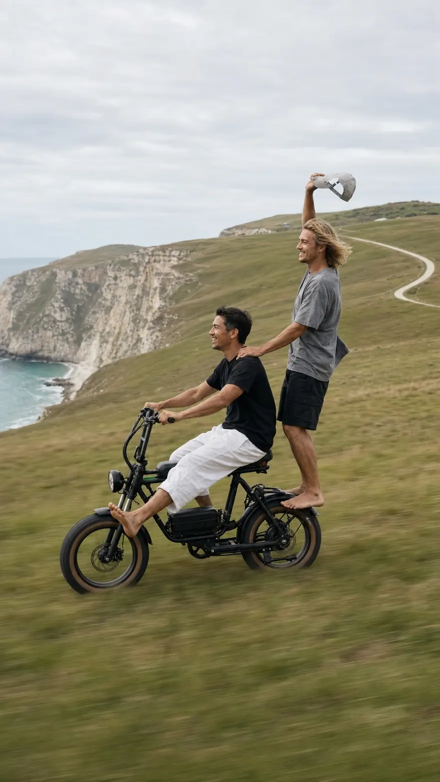 Coastal Minibike: Two-up on a fat-tire e-minibike across a green headland