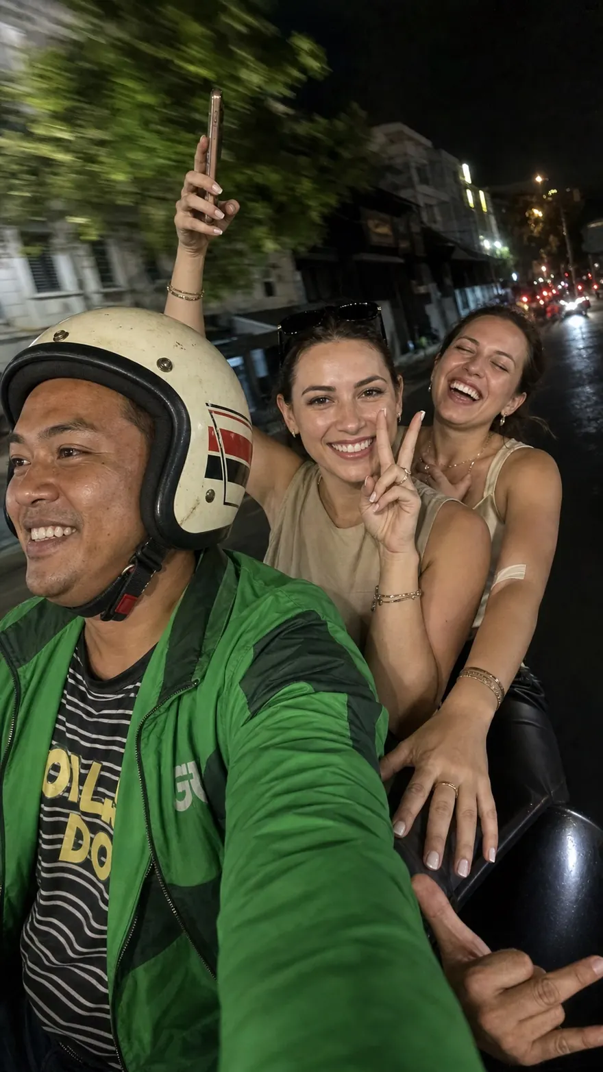Night Motorbike Selfie: Blurry three-up selfie riding through town after dark