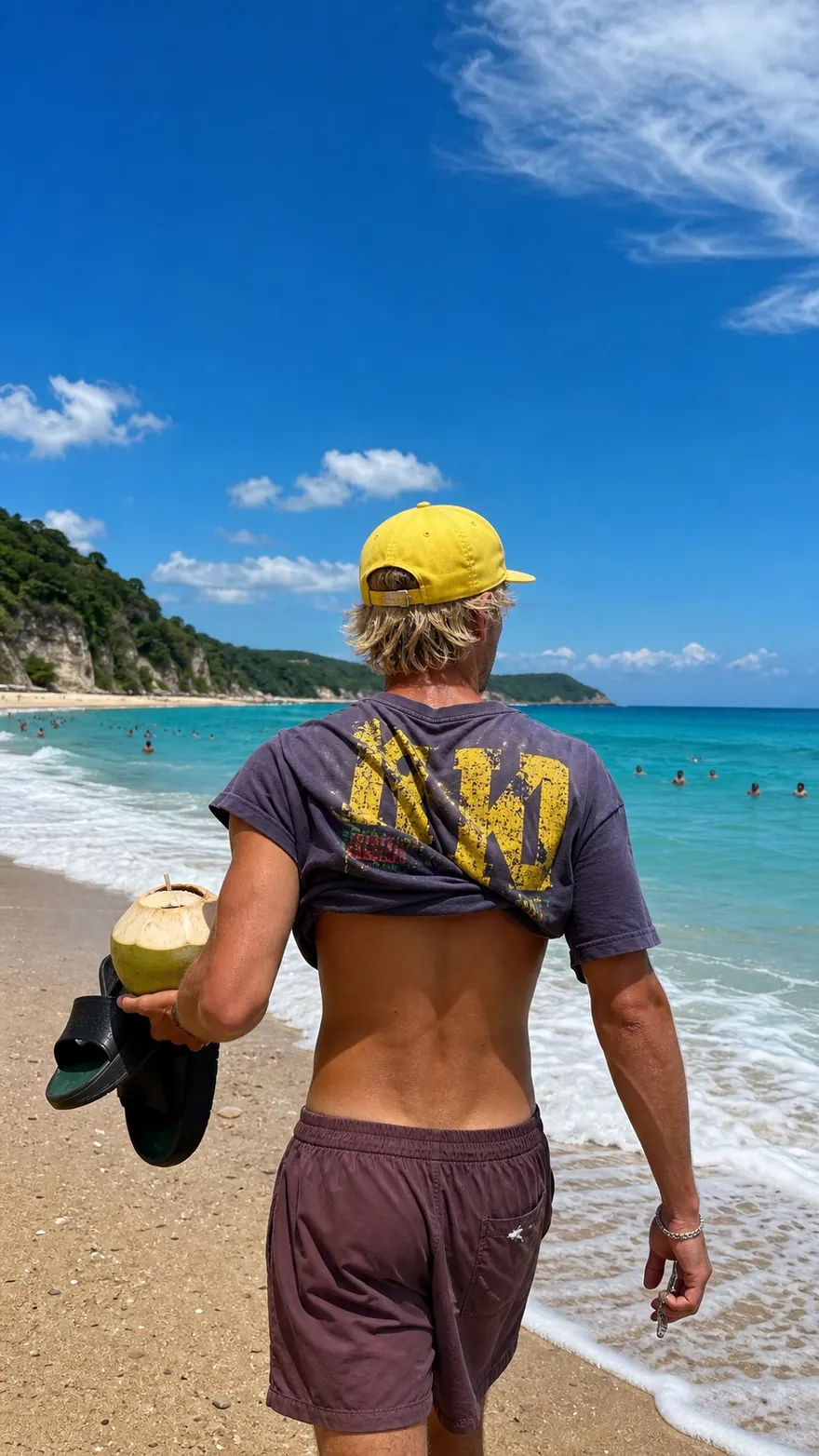Shoreline Walk: Walking the waterline with a coconut and slides in hand
