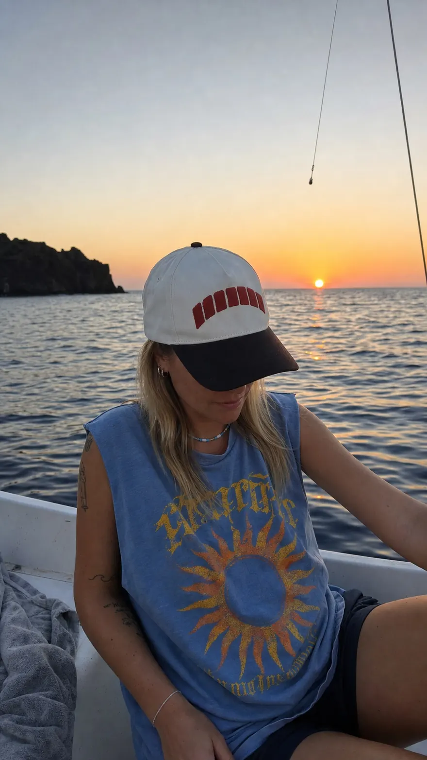 Sunset Skiff: Golden-hour candid on a small white boat